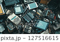 Vintage electronics, ewaste recycling pile highlighting environmental impact 127516615