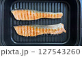 Salmon cooked on the grill 127543260