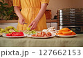 Housewife preparing apples for dehydration 127662153