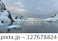 Big Iceberg in Antarctica Winter Scenery, Amazing Shape Ice Formation of Massive Large Enormous Blue Icebergs in Antarctic Peninsula Landscape Seascape with Ocean Sea Water 127678824