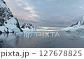 Big Iceberg in Antarctica Winter Scenery, Amazing Shape Ice Formation of Massive Large Enormous Blue Icebergs in Antarctic Peninsula Landscape Seascape with Ocean Sea Water 127678825
