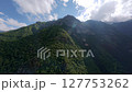 FPV drone ascending to mountain peak 127753262