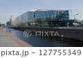 City canal with modern architecture glass facade train station in Delft 127755349