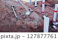 Prepare construction site with drainage PVC pipes fitting connections in trench ready for building. 127877761