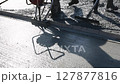 Construction workers are pouring, smoothing concrete mix on foundation surface as works day 127877816