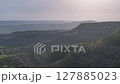 4k aerial drone panning shot of plateaus and mountains on a sunny day 127885023