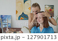 4K. The bride is getting ready for the wedding. The girl is being made up 127901713