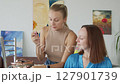 4K. The bride is getting ready for the wedding. The girl is being made up 127901739