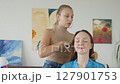 4K. The bride is getting ready for the wedding. A girl gets her hair done 127901753