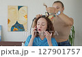 4K. The bride is getting ready for the wedding. A girl gets her hair done 127901757