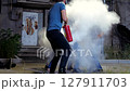 Street Fight with Fire Extinguisher in an Industrial Area. Night, 4k slow motion 127911703