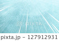 Light streaks and radial lines on a textured light blue-green background 127912931