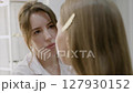 Makeup artist works on creating model look. Close-up 127930152