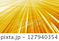 Light streaks on yellow background, intersecting thin glowing light lines 127940354