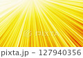 Gold streaks of light on a bright yellow background 127940356