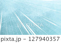 Strong light streaks on light blue background 127940357