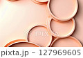 Peach colored circles scale and rotate on a matching solid background 127969605
