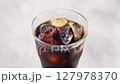 Cool iced coffee poured into a glass 127978370