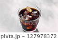 Cool iced coffee poured into a glass 127978372