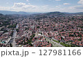 Aerial: Sarajevo cityscape with river and hills Bosnia and Herzegovina	 127981166