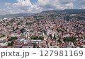 Breathtaking view of Sarajevo's dense red rooftops amid green hills, Bosnia	 127981169