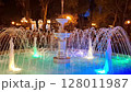 Beautifully illuminated fountain at night. There is a beautiful fountain in the city garden of Odessa. 128011987