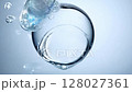 Water droplet forming and breaking on a smooth surface 128027361