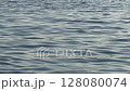 Gentle Ripples on Calm Sea Surface Captured Peacefully 128080074