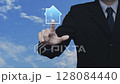 Businessman pressing house flat icon over blue sky with white clouds, Business real estate concept 128084440