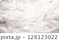 Luxurious creamy white texture background animation resembling a smooth skincare or cosmetic cream, with elegant, flowing waves and a glossy, luminous finish. Evokes purity, hydration and softness. 128123022
