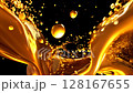 Golden liquid splashing and forming vivid droplets in slow motion. Perfect for luxury product presentations 128167655