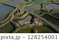 Beautiful colorful salt marshes on a sunny day, reflections in the water, 4k 128254001