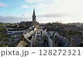 Aerial footage of the streets of a Missillac commune, view of a big church, 4k 128272321