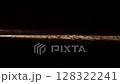 Slow motion snow falling night darkness. car driving headlights at night shining snowfalls in winter 128322241
