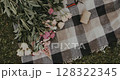 woman decorates bouquet as gift. Floristry creating flower 128322345