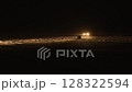 Drifting lights car. professional driver drifting car on snowing night asphalt race track winter. 128322594