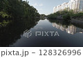 Beautiful scenic views of urban rivers, showcasing reflections and lush greenery all around 128326996