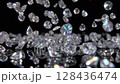 Slow-motion video of teardrop-shaped diamonds falling 128436474
