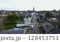 Aerial footage of the beautiful street of Missillac commune, Saint Pierre church 128453753