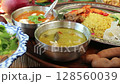 Dip rice in green curry 128560039