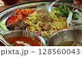 Green curry served over rice 128560043