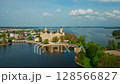 Aerial view of Schwerin Castle, a fairytale palace set amidst lakes and gardens in Germany. Scenic landscape, cultural landmark, perfect for travel and architecture themes. 128566827