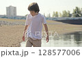 A Young Child Adventure Exploring the Waters Edge on a Bright and Sunny Day in Nature 128577006