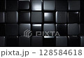 A modern arrangement of glossy black cubes with subtle reflections, creating a striking geometric pattern. The minimalistic design evokes sophistication and futuristic style in a sleek composition. 128584618