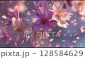 Delicate cherry blossom flowers in soft pink tones gently float on a spring breeze, with petals swirling through the air, set against a dreamy, pastel-colored background. 128584629