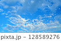 Timelapse of clouds moving in the blue sky. 128589276