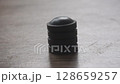 black circle magnet element arranging and falling to batch on table 128659257
