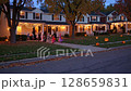 Halloween town bustling with people dressing up in costumes 128659831