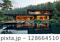 Modern house on a lake with a forest in the background. concept of ecological house keeping and luxury real estate, nature retreats, sustainable living, and tranquil, harmonious lifestyle. 128664510