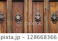 ornate wooden doors antique decorative hardware historic building facade 128668366